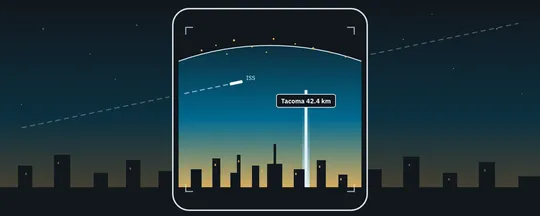 A phone above the Seattle skyline at dusk, its screen showing an AR tower, the Earth and the ISS